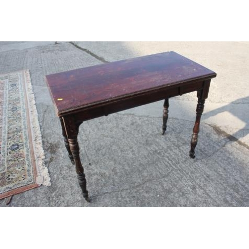 390 - A late 19th century rosewood fold-over top card table, on turned supports, 38