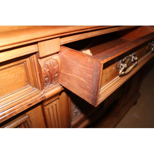 415 - A late 19th century carved walnut mirror back sideboard, fitted single shelf over three drawers and ... 