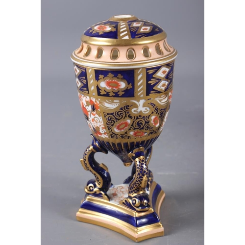 6 - A pair of Davenport Imari decorated pot-pourri vases and covers (one repaired with losses), on dolph... 