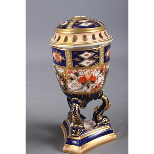 6 - A pair of Davenport Imari decorated pot-pourri vases and covers (one repaired with losses), on dolph... 