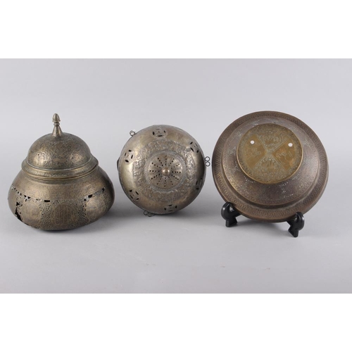 116 - Two brass mosque lamps with engraved and pierced decoration and a similar stand