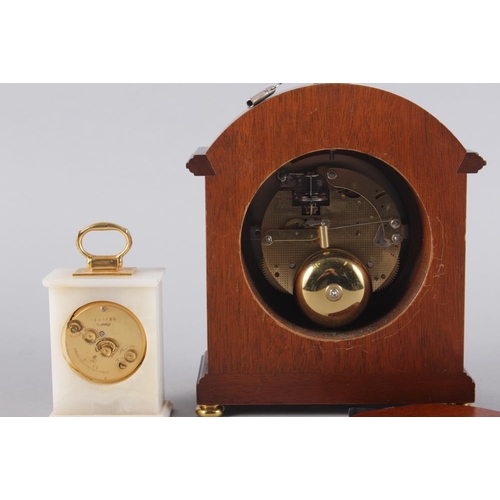 120 - A Comitti of London mahogany cased mantel clock with white enamel dial and Roman numerals, 9 1/2