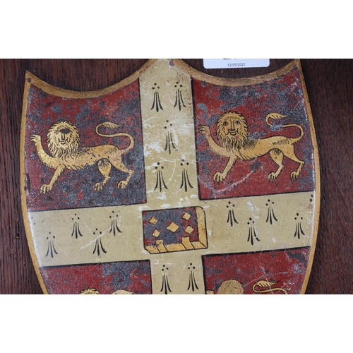 202 - Two painted metal coats of arms on easel stands, 12 1/2