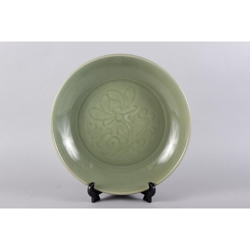 89 - A Chinese celadon glazed charger, 14 1/2