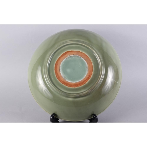 89 - A Chinese celadon glazed charger, 14 1/2