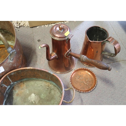 136 - A copper side-handled coffee pot, two copper coal scuttles, two warming pans and other items