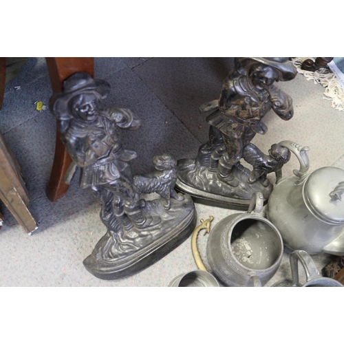 138 - A quantity of pewter tankards and mugs, a pair of cast iron door stops, 13 1/2