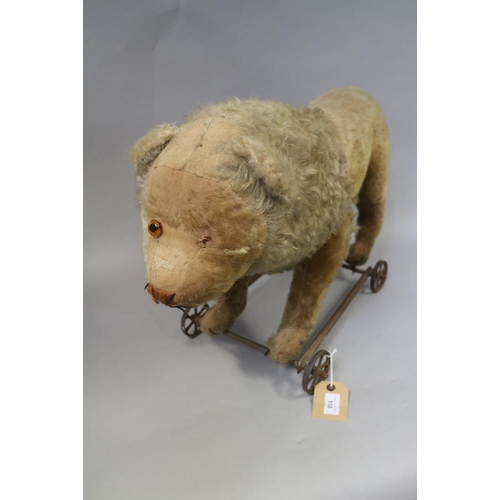 158 - A child's Victorian ride-along straw stuffed lion, 25