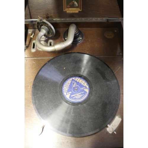 189 - An HMV model 103 oak cased gramophone and a collection of records