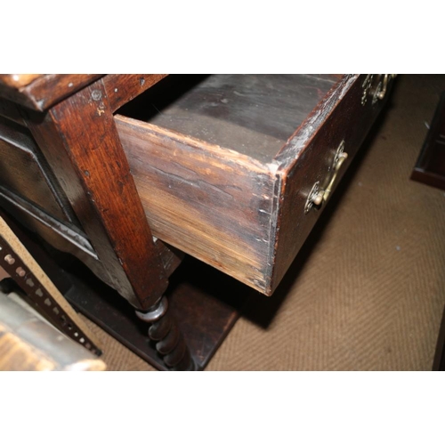 373 - An 18th century oak dresser base, fitted three drawers over pot board, on turned supports, 68