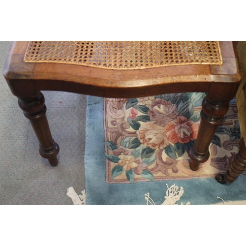 397 - A Victorian mahogany elbow chair with cane panel seat, on turned supports