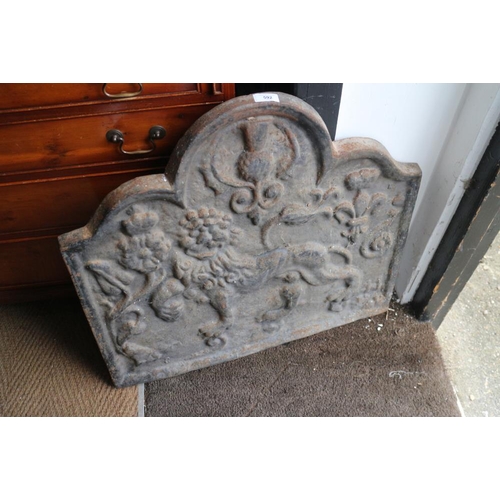 592 - A cast iron fire back with lion rampant and thistle design CHARITY