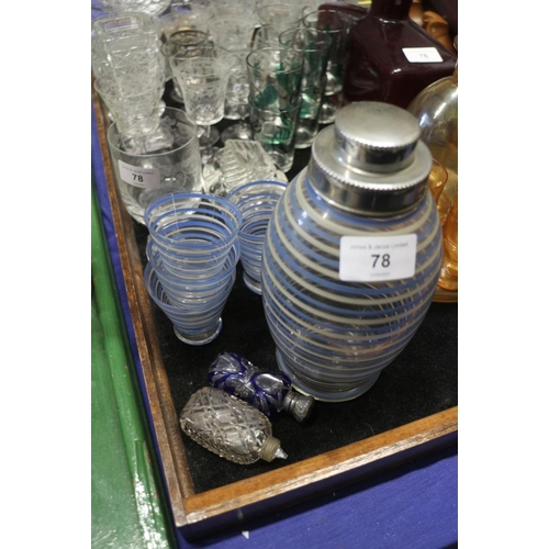 78 - A blue and white patterned glass cocktail set, a red coloured glass decanter, 7 1/4