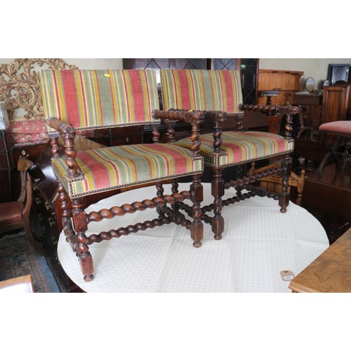 374 - A pair of Restoration design carved walnut elbow chairs with lion mask terminals, stuffed over seats... 