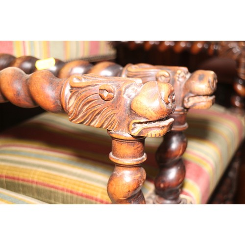 374 - A pair of Restoration design carved walnut elbow chairs with lion mask terminals, stuffed over seats... 