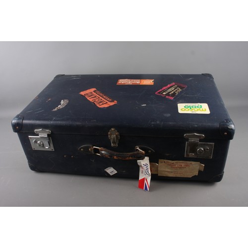 590 - A Globe Trotter suitcase with 1950s-90s labels, 29