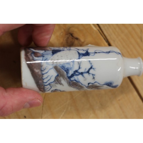 100 - A Chinese porcelain cylindrical snuff bottle, decorated with a fisherman, six character mark to base... 