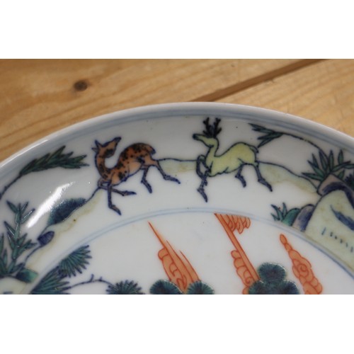 99 - An 18th century Chinese porcelain Doucai shallow dish, decorated flora and fauna, 7 1/2