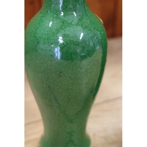 97 - A pair of Chinese  green crackle glazed baluster vases, 9