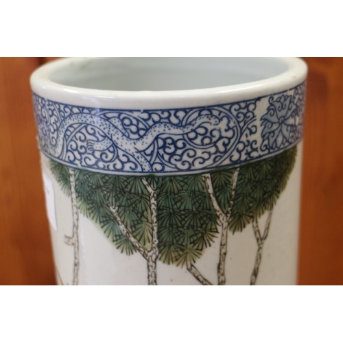 94 - A pair of Chinese cylindrical vases, decorated birds and trees with blue dragon borders, 11