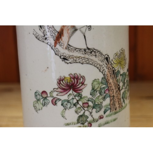 94 - A pair of Chinese cylindrical vases, decorated birds and trees with blue dragon borders, 11