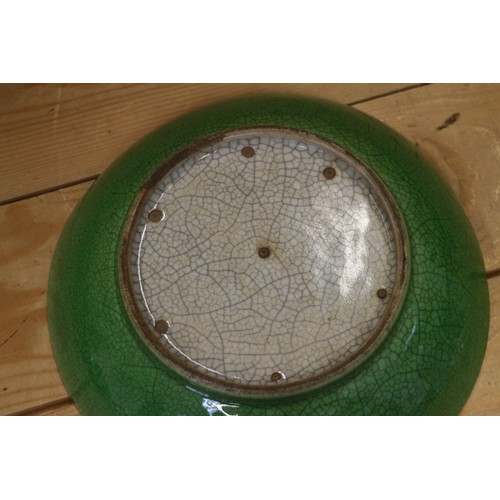 91 - A Chinese green crackle glazed shallow dish, 8 1/2