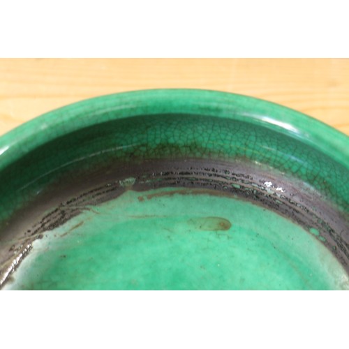 91 - A Chinese green crackle glazed shallow dish, 8 1/2