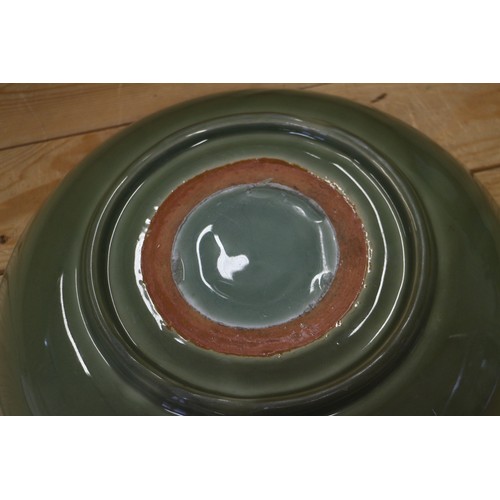 89 - A Chinese celadon glazed charger, 14 1/2