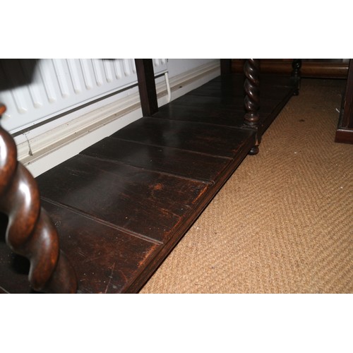 373 - An 18th century oak dresser base, fitted three drawers over pot board, on turned supports, 68