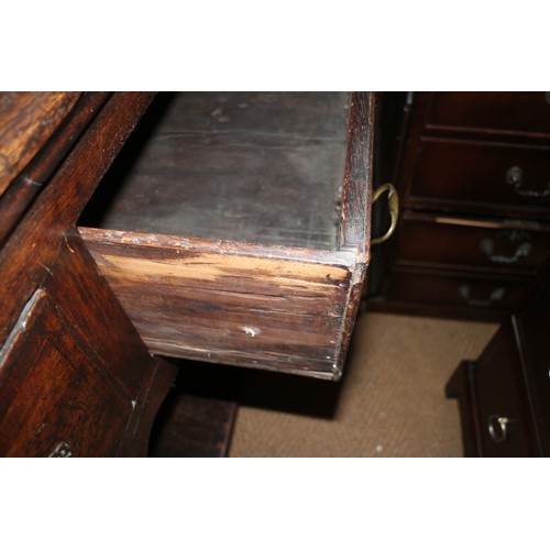 373 - An 18th century oak dresser base, fitted three drawers over pot board, on turned supports, 68