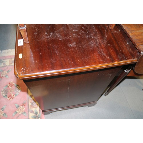 407 - A Georgian mahogany kneehole writing desk with lift-up lid and fitted interior over six drawers and ... 