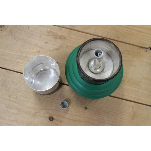 259 - A green plastic and silver plate mounted cocktail shaker, 11