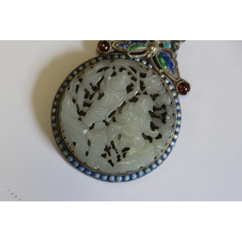 92 - A Chinese pale celadon roundel, decorated figures, in a white metal and enamel pendant frame, three ... 