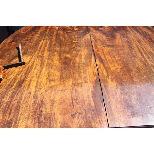 403 - A late 19th century mahogany extending dining table with two extra leaves, on line inlaid square tap... 