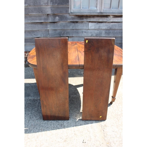 403 - A late 19th century mahogany extending dining table with two extra leaves, on line inlaid square tap... 