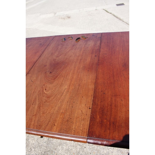 375 - A 19th century mahogany double pedestal dining table with one extra leaf, on turned columns and quad... 