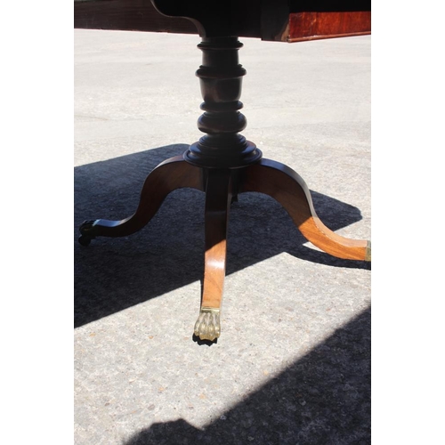 375 - A 19th century mahogany double pedestal dining table with one extra leaf, on turned columns and quad... 