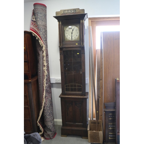 411 - An Arts & Crafts design oak long case clock with silvered dial, Arabic numerals and chapter ring, 83... 