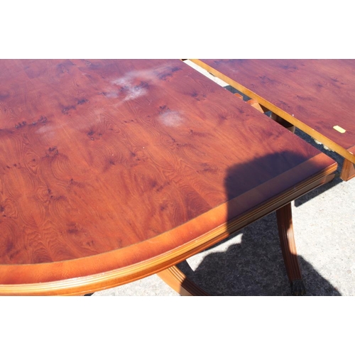 457 - A yew and banded double pedestal dining table with one extra leaf, 39