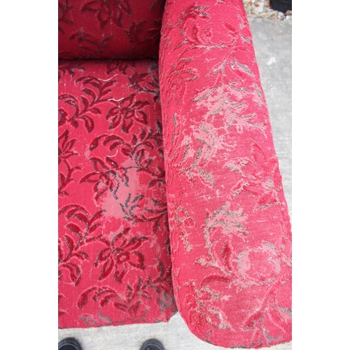 463 - An Edwardian two-seat settee, upholstered in a red floral moquette, on cabriole supports, and a matc... 