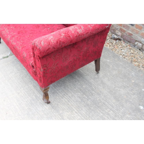 463 - An Edwardian two-seat settee, upholstered in a red floral moquette, on cabriole supports, and a matc... 