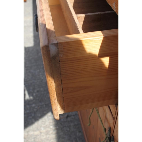 507 - A pine dresser, fitted shelves over three drawers and cupboards, on block base, 66