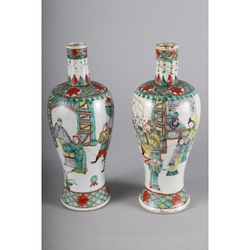 108 - A pair of Chinese porcelain famille verte baluster vases, decorated figures, 10 1/2