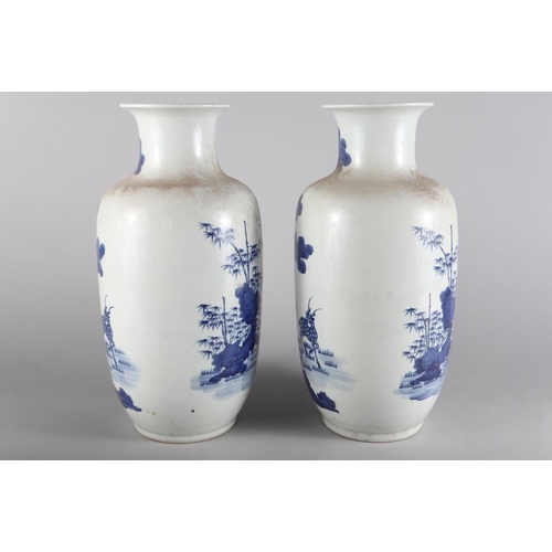 110 - A pair of Chinese porcelain blue and white baluster vases, decorated fallow deer, 17 3/4