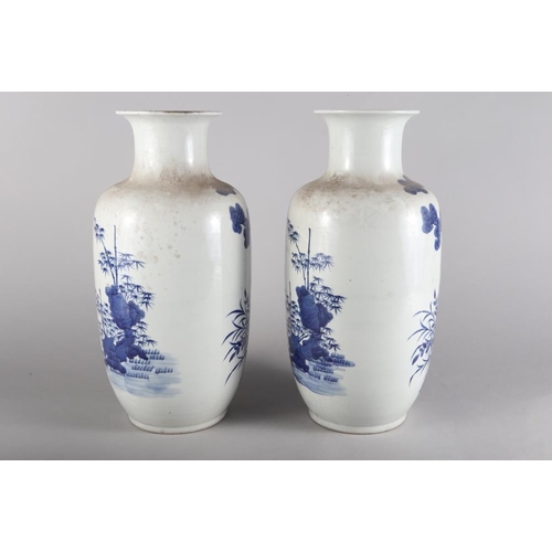 110 - A pair of Chinese porcelain blue and white baluster vases, decorated fallow deer, 17 3/4