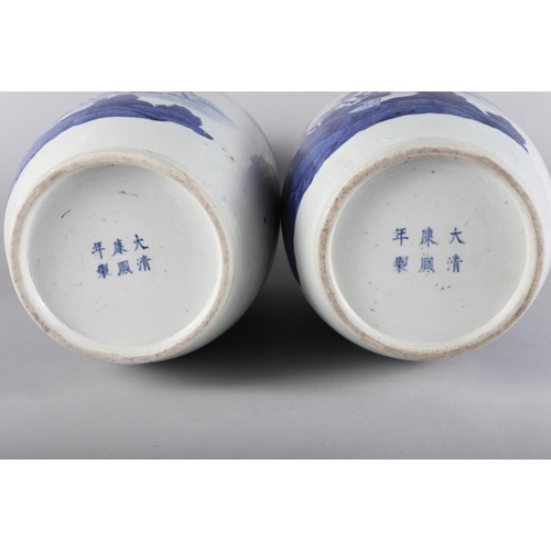 110 - A pair of Chinese porcelain blue and white baluster vases, decorated fallow deer, 17 3/4