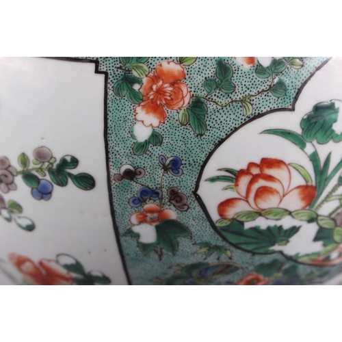 121 - A Chinese porcelain inverted baluster vase and cover, decorated in famille verte enamels, six charac... 