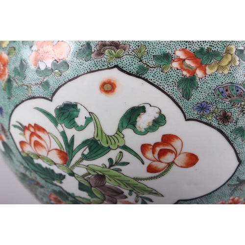 121 - A Chinese porcelain inverted baluster vase and cover, decorated in famille verte enamels, six charac... 