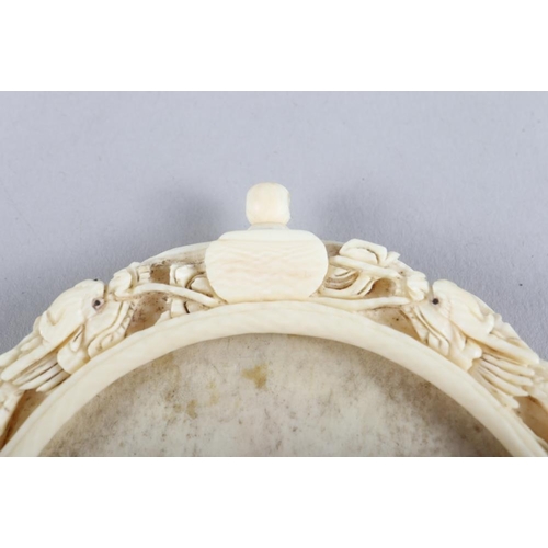 125 - A 19th century Chinese carved ivory photograph frame, decorated two dragons, 5