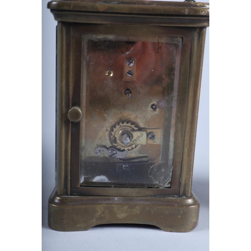 132 - A French brass cased carriage clock with white enamel dial and a modern Kienzle carriage clock